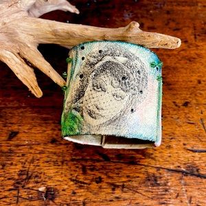 Hand painted/printed leather cuff bracelet.